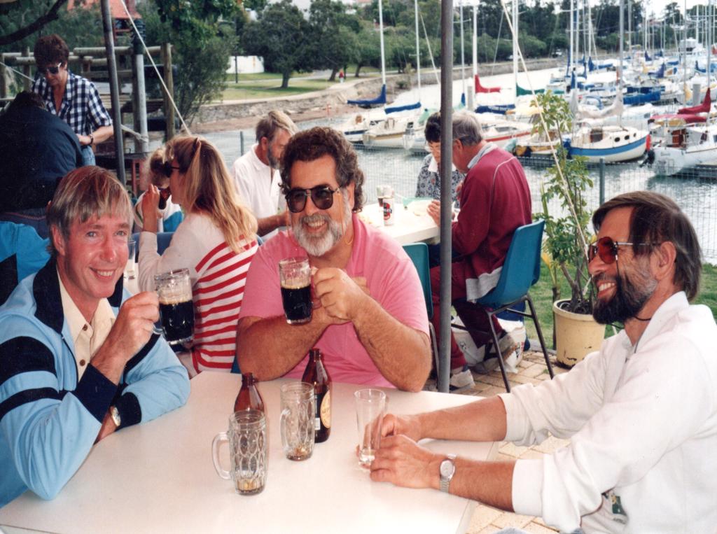 Ken Darland, Peter Herbert and Les Welburn drinkng what appears to be frothy vegemite soup